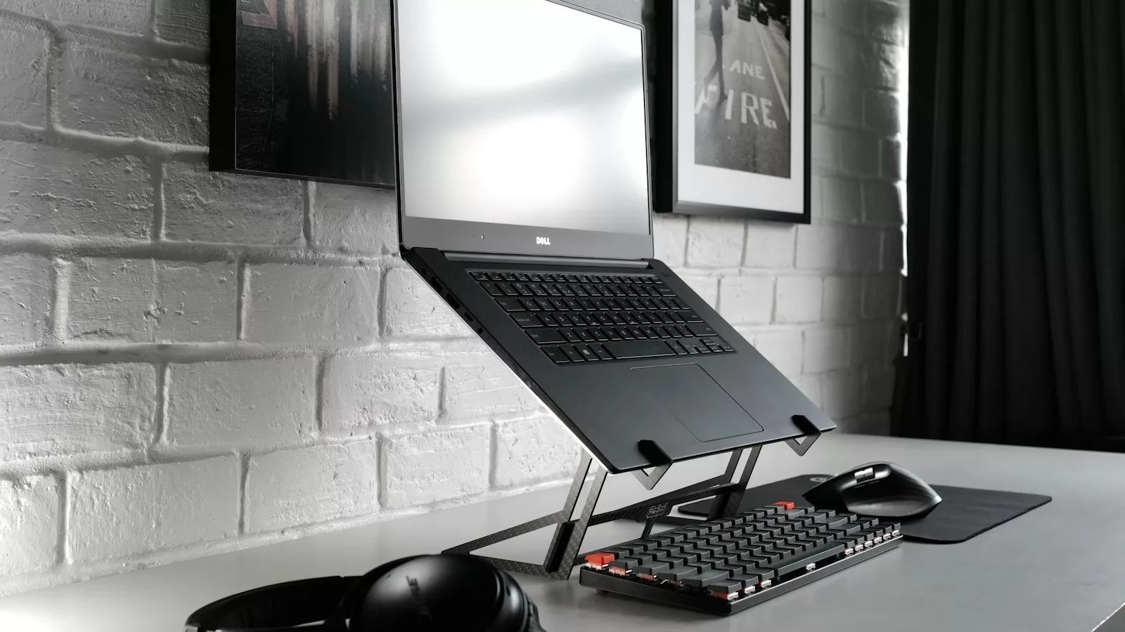 Black flat screen computer monitor and black computer keyboard