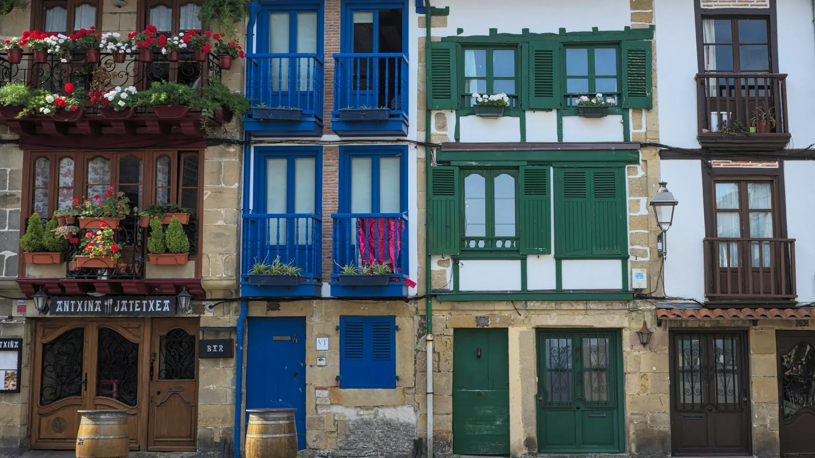 Blue wooden door on gray concrete building
