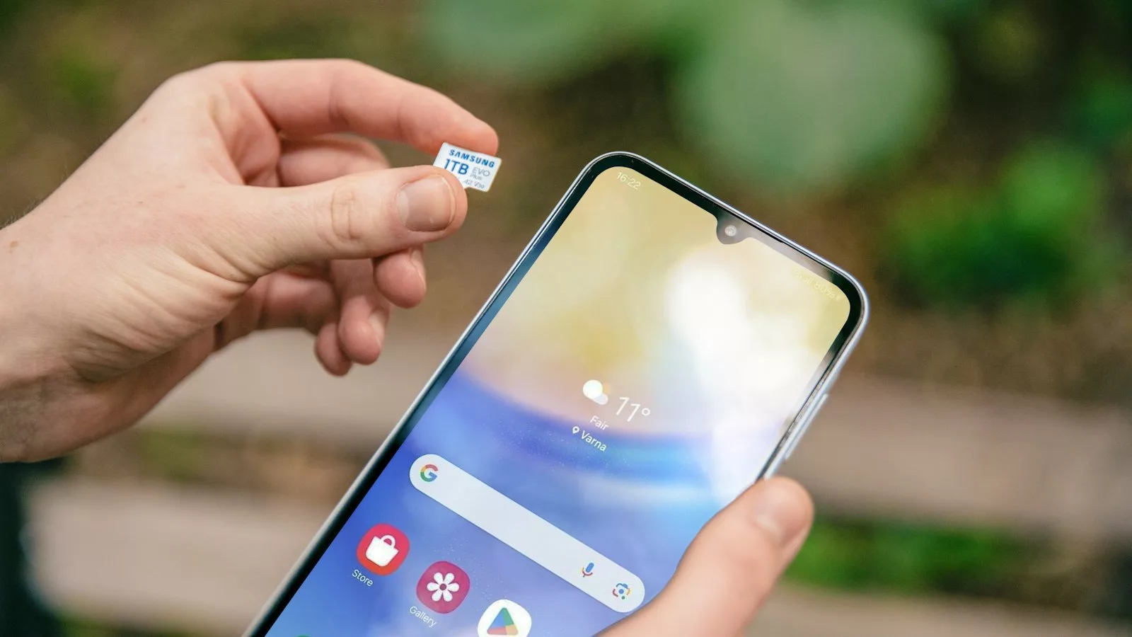 A person holding a cell phone in their hand